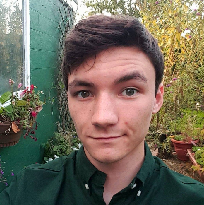 Portrait of Will smiling at the camera